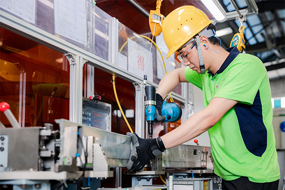 Workers wearing hard hats at work